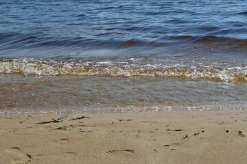 waves on the river beach