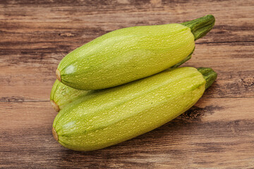 Young tasty zucchini over board