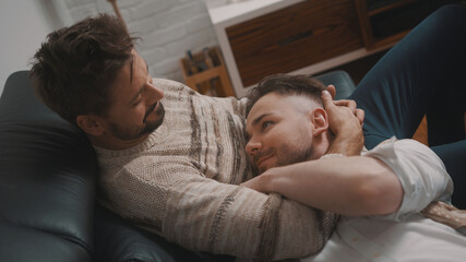 Passionate hug between homosexual partners. Man soothing his partner. High quality photo