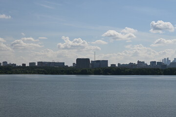 Sunny sky with clouds on the Bay with seagulls and sailboat