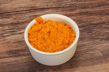 Tumeric powder in the bowl