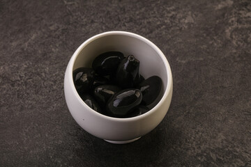 Pickled black olives in the bowl