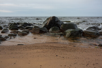 Fototapeta na wymiar City Tuja, Latvia.Beach with stones and sand.Travel photo.