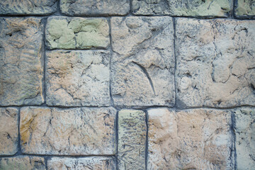 wall of rectangular stone bricks. background and texture of cobblestones. 