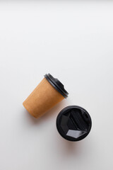Kraft paper cup with tea hot drink mockup template on white background. Coffee to go. Flat lay, top view, copy space