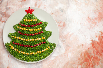 top view green salad in new year tree shape inside plate on the light background photo salad meal color xmas