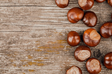 Chestnuts on an old wooden table