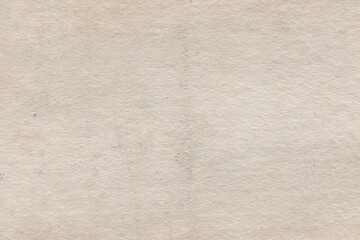 Vintage and old looking paper background. Retro cardboard texture. Grunge paper for drawing. Ancient book page.