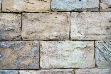 wall of rectangular stone bricks. background and texture of cobblestones. 