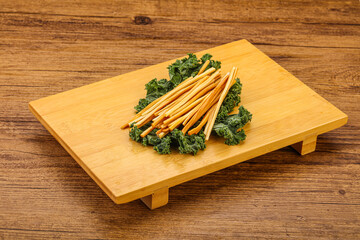 Chechel cheese sticks over board