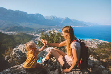 Family mother with daughter traveling in Turkey active vacation mom and child hiking together high...