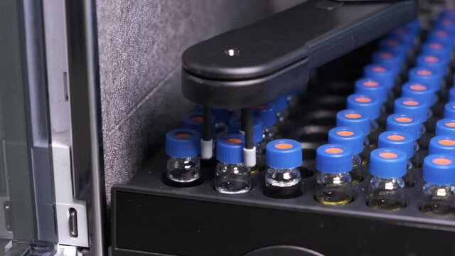Automated conveyor line of chromatographic robotic device. Process of work with medical samples in tubes. Testing of vaccine using HPLC system.