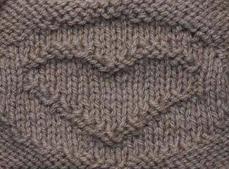  Knitted woolen heart shape pattern as background. Happy Valentines Day.  Love concept.