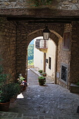 Typical alley in the ancient medieval village of Montefioralle, Tuscany, Italy