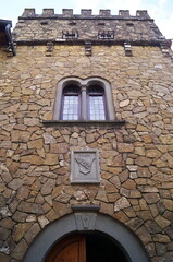 Facade of a palace in the ancient medieval village of Montefioralle, Tuscany, Italy