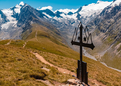 Beautiful alpine view with a black steel cross at the famous Hohe Mut summit, Obergurgl, Oetztal, Tyrol, Austria