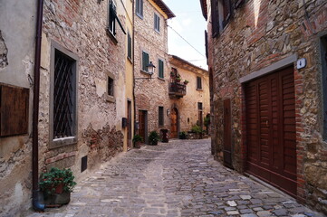 Plakat Typical street in the ancient medieval village of Montefioralle, Tuscany, Italy