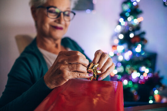 Woman wrapping Christmas present