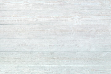 A universal background of textured boards, painted blue white. Ready light background for flat lay and other design ideas. Pale blue plank floor or wall in retro style. Copy space.