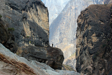 Hikers in the central part of one of the deepest ravines of the world, Tiger Leaping Gorge in Yunnan, Southern China