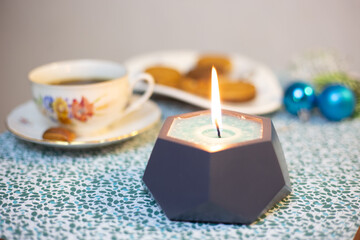 Burning candle on the table