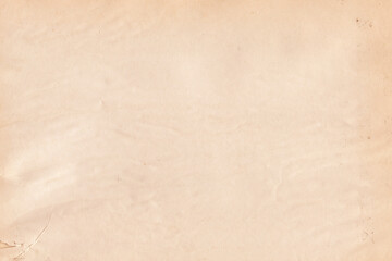 Vintage and old looking paper background. Retro cardboard texture. Grunge paper for drawing. Ancient book page.