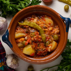 Mexican style cod called a la vizcaina on white background