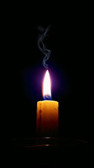A beautiful candle burning in the dark.
Photo taken on a phone. 