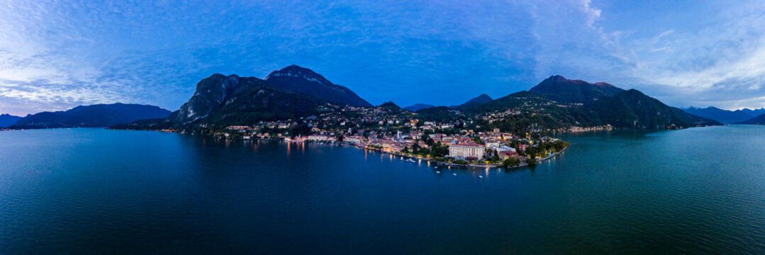 Italy, Province of Como, Menaggio, Helicopter panorama of Lake Como and coastal town at dawn