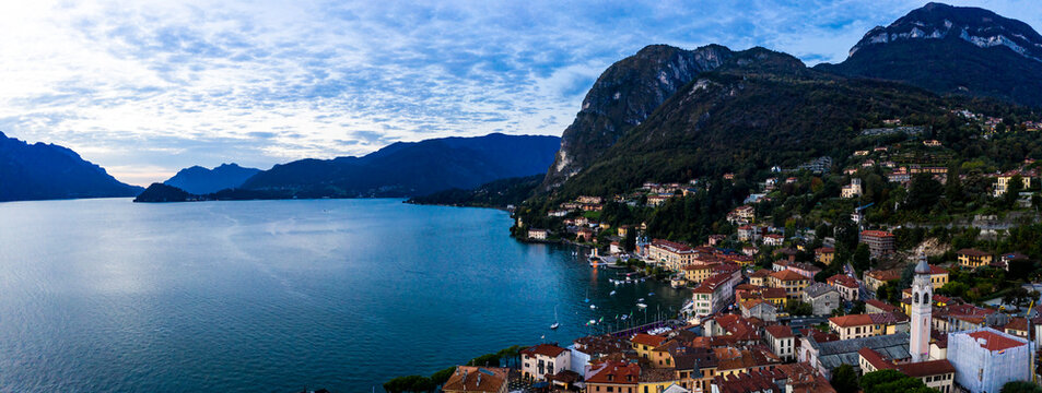 Italy, Province of Como, Menaggio, Helicopter view of town on shore of Lake Como at dawn