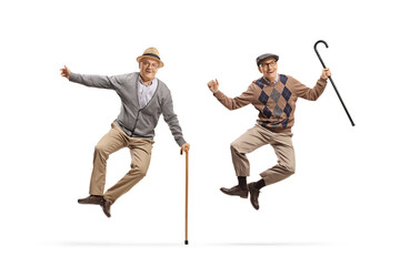 Happy and joyful elderly men jumping