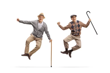 Fotobehang Happy and joyful elderly men jumping © Ljupco Smokovski