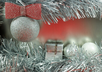 Christmas decoration with silver balls, tinsel, gifts. Winter  festive background