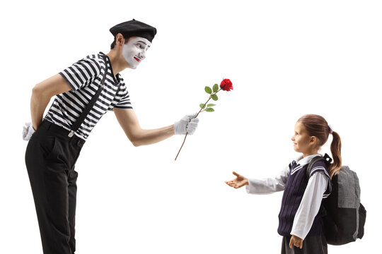 Mime actor giving red rose to a schoolgirl