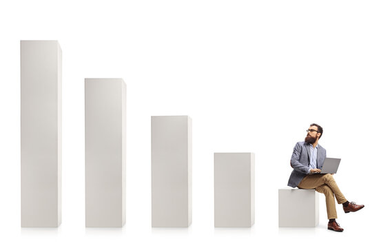 Professional man with a laptop sitting on a column and looking at rising column bars