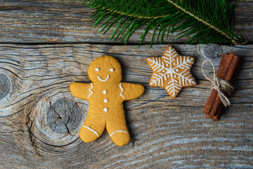 Christmas homemade gingerbread cookies over wooden table