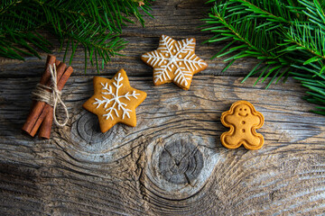 Christmas homemade gingerbread cookies over wooden table