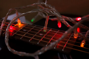 Garland light bulbs in dark on guitar strings
