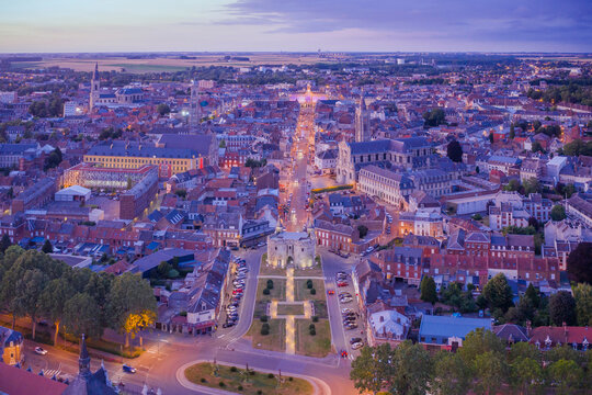 France, Nord, Cambrai, Aerial view of city at dusk
