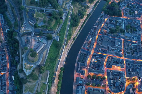 Belgium, Namur Province, Namur, Aerial view of city canal at dusk
