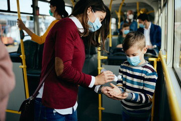 Hand disinfection in a public transport!