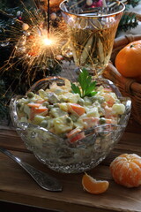 Naklejka na ściany i meble Traditional Russian Christmas Salad Olivier with champagne and tangerines