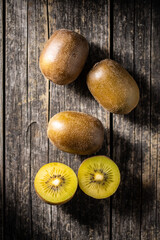 Fototapeta na wymiar Halved ripe yellow kiwi fruit.