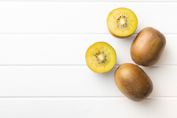 Halved ripe yellow kiwi fruit.