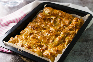 Close up on fresh baked homemade cheese pie in Casserole on the table