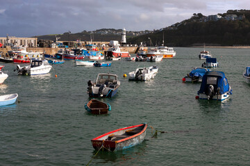 Fototapeta na wymiar St. Ives' harbour and Smeaton's Pier at high tide from Wharf Road, St Ives, Cornwall, UK