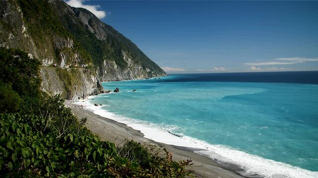 Turquoise water sea cliff coastline in Taroko Gorge National Park, Taipei, Taiwan. Mid angle, static movement, slow motion, HD.