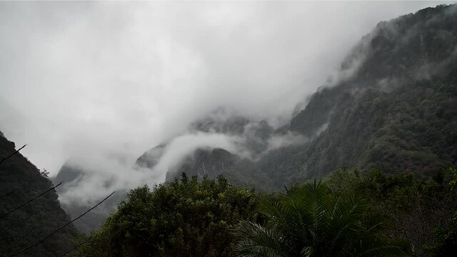 Misty foggy mountains in Taroko Gorge National Park, Taipei, Taiwan. High angle, parallax movement, slow motion, HD.