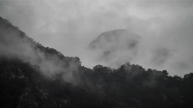 Misty foggy mountains in Taroko Gorge National Park, Taipei, Taiwan. High angle, parallax movement, slow motion, HD.
