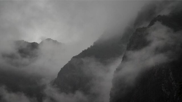 Misty foggy mountains in Taroko Gorge National Park, Taipei, Taiwan. High angle, parallax movement, slow motion, HD.